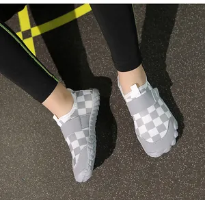 Close-up of children's gray checkerboard water shoes with non-slip flexible rubber sole.