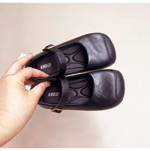 Close-up view of black children's Mary Jane shoes with comfortable textured insoles