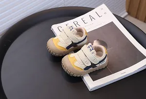 Close-up of color-block toddler sneakers on a minimalist background