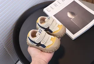 Close-up of baby sneakers with anti-collision toe and cute panda motif detail
