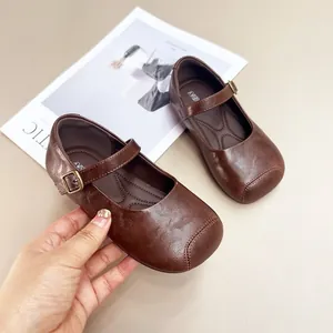 Classic brown girls' leather Mary Janes with soft soles and buckle straps