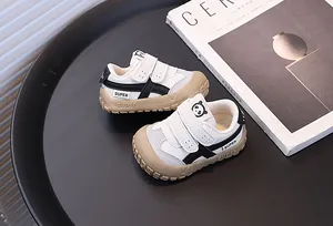Detailed shot of toddler sneakers with panda design and protective anti-collision toes
