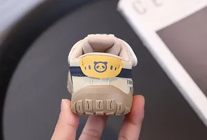 Close-up detail showing the durable rubber sole and panda design on the toddler sneaker heel