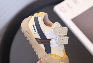 Detail view of toddler walking shoes with velcro straps and anti-collision toe