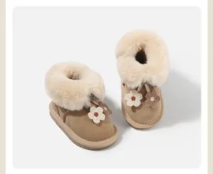 Close-up view of cozy girl's snow boots with fluffy fur lining and crochet flower detail