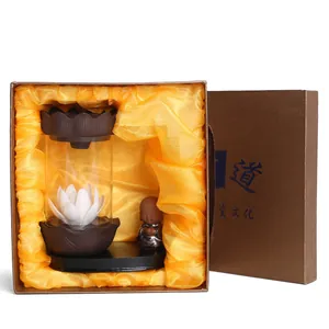 Lotus backflow incense burner with monk figurine and LED light in premium gift box