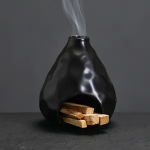 Porta incienso de cerámica negra moderna para madera Palo Santo y meditación zen