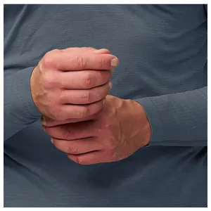 Detailed macro view of the seamless cuff and breathable mesh fabric on men's gray sports shirt