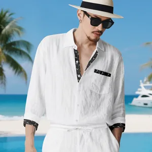 Elegant men's white linen set detail featuring black patterned collar and pocket trim