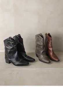 Detail view of vintage Western ankle boots with gold studs in multiple color options.