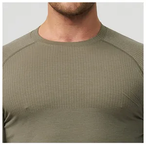 Close-up detail of olive green seamless sports t-shirt with breathable waffle texture.