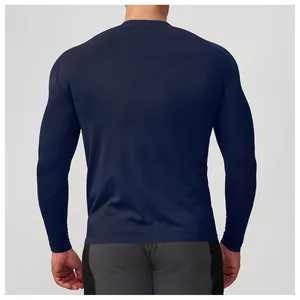 Detailed back view of a men's navy blue seamless athletic long-sleeve T-shirt for fitness