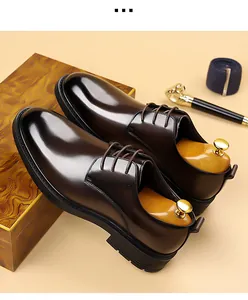Side view of elegant brown leather derby shoes with professional business accessories.