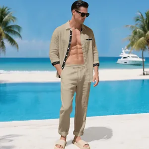 Men's khaki linen resort set with printed trim detail shown on a sunny beach background