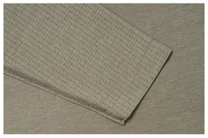 Detailed close-up of breathable waffle texture fabric on a seamless men's sports t-shirt