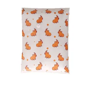 Durable vacuum compression storage bag with cute orange capybara pattern for bedding.
