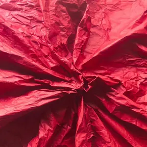 Detailed texture of red crepe paper for DIY flower making and handicraft crafts