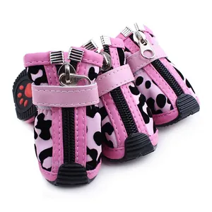 Close-up of pink leopard print soft leather dog boots with zipper and velcro strap