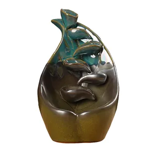 Teal and bronze ceramic backflow incense burner with lotus leaf cascading design