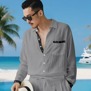 Close-up of men's casual grey linen shirt set with patterned cuff and pocket details