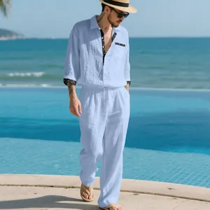 Casual light blue linen two-piece set for men styled in a sunny beach resort setting