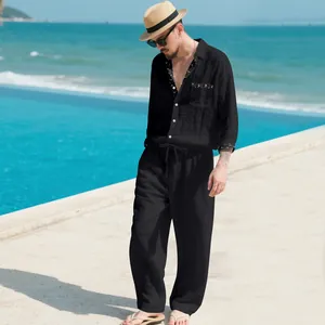 Casual men's black linen two-piece set featuring long sleeve shirt and matching trousers.