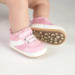 Detailed view of pink canvas baby walking shoes with non-slip soles