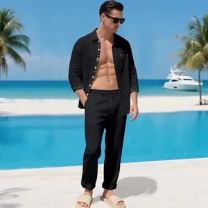 Men's black linen two-piece set shown in a sunny tropical beach resort setting