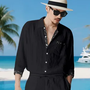 Detailed view of men's black linen suit featuring elegant bird pattern sleeve trims