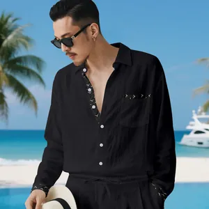 Close-up detail of black linen casual set for men featuring decorative bird embroidery