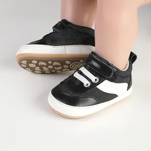 Close-up of black and white canvas walking shoes for newborn infants and toddlers