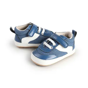 Close-up of blue and white baby sneakers with Velcro straps and canvas texture