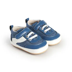 Detailed close-up of blue and white canvas baby walking shoes for infants and newborns