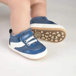 Detail view of the soft non-slip sole on blue denim baby prewalker walking shoes