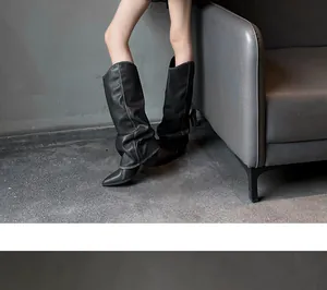 Chic black slouched high gaiter boots featuring a pointed toe and stiletto heel design.