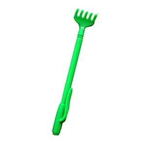 Close-up view of a green plastic hand-shaped backscratcher on a white background.