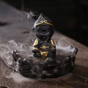 Zen style Sun Wukong backflow incense burner made of purple clay with lotus base
