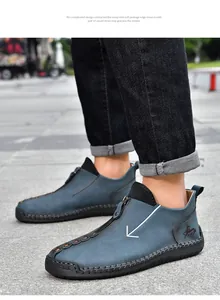 Side view of blue leather men's casual Martin boots with zipper and hand-stitched sole.