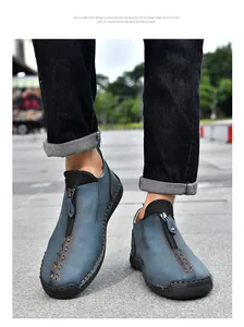 Detail of men's blue leather casual boots with zipper and hand-stitched seams
