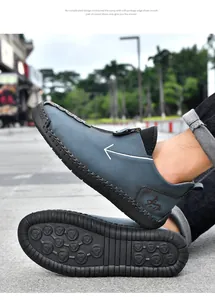 A detailed view of blue men's casual leather shoes with zipper and non-slip sole