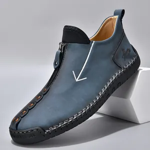 Men's casual blue leather boots with side zipper and handmade stitching details.