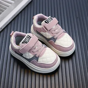 Pink quilted leather sneakers for kids with velcro strap and comfortable rubber sole