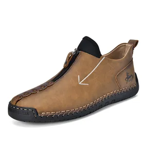Classic brown leather men's casual boots featuring front zipper and handmade stitching