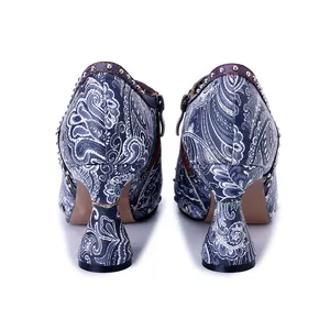 Rear view of paisley printed leather high heels with rivet detailing and unique heel.
