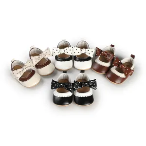 Detail view of baby girl princess toddler shoes with polka-dot bow in multiple colors