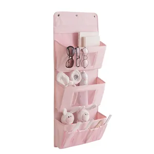 Pink wall-mounted fabric hanging storage bag with 3 pockets and mesh organizers for doors