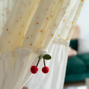 Pastoral white cotton door curtain with daisy print and plush cherry pendant detail.
