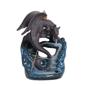 Backflow incense burner featuring a winged dragon on a blue glaze waterfall base