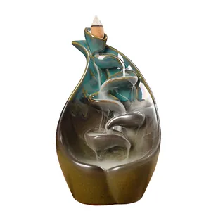 Teal ceramic backflow incense burner with lotus leaf design for home decor