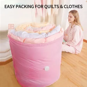 Large pink vacuum compression storage bag for quilts and clothes shown in home setting